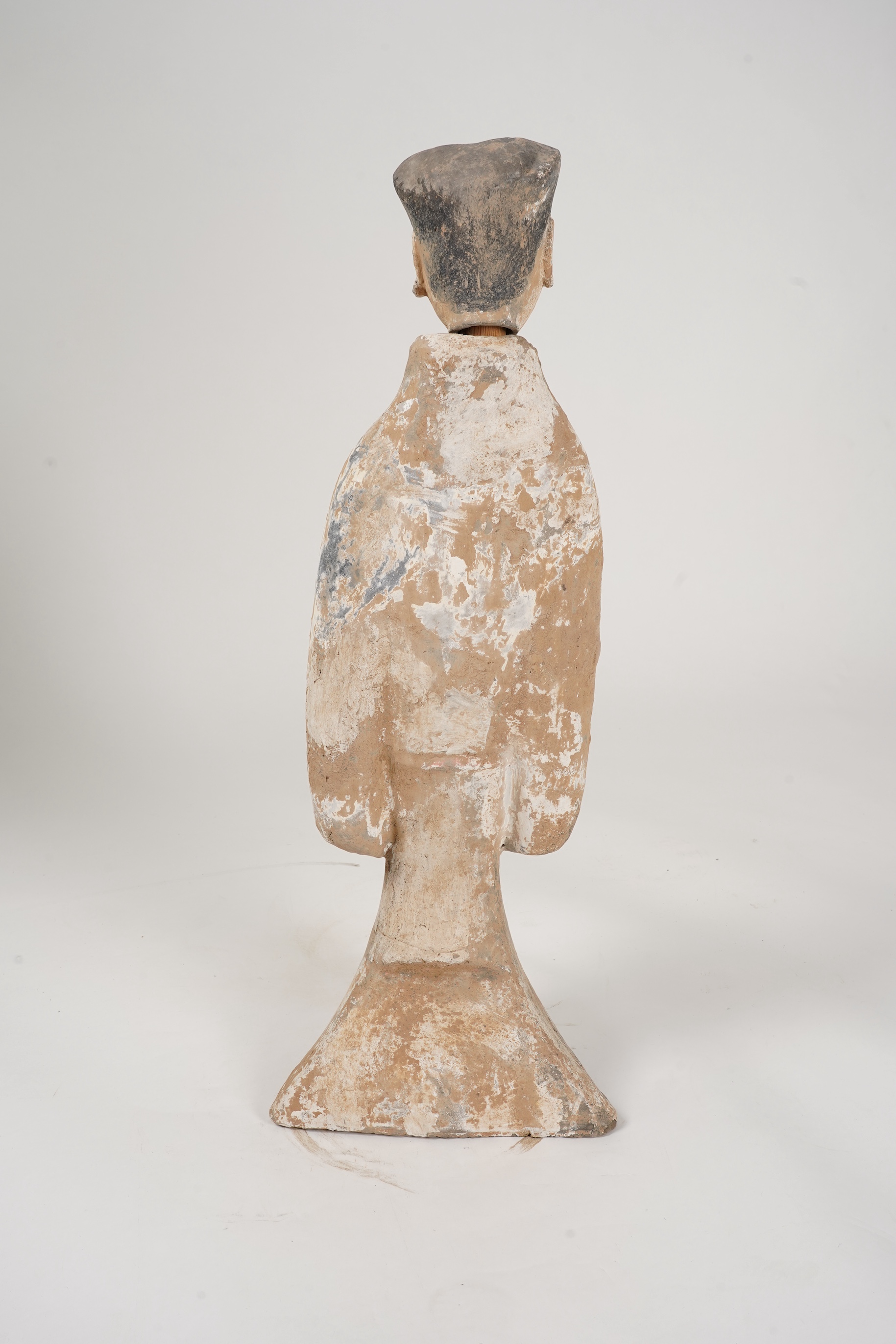 A large Chinese polychrome pottery figure of a female attendant, Han dynasty or later